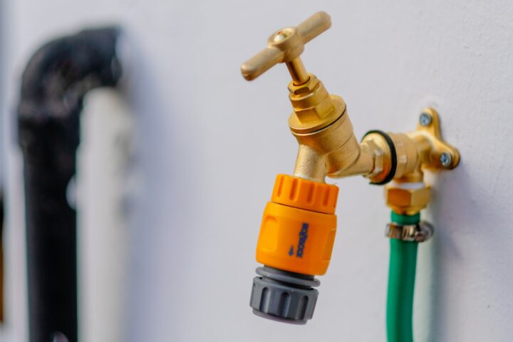 brass-colored faucet