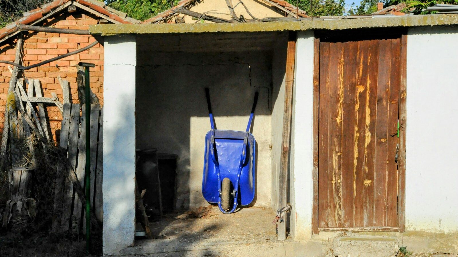 A small building with a blue chair in it