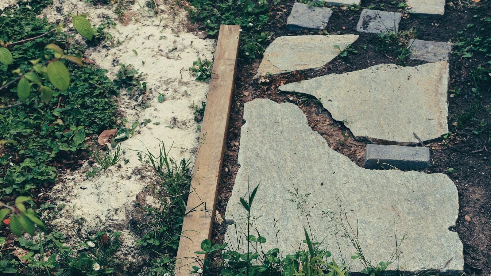 brown wooden plank on gray concrete floor