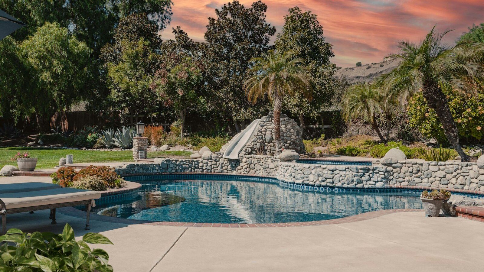 a pool with a slide in the middle of it