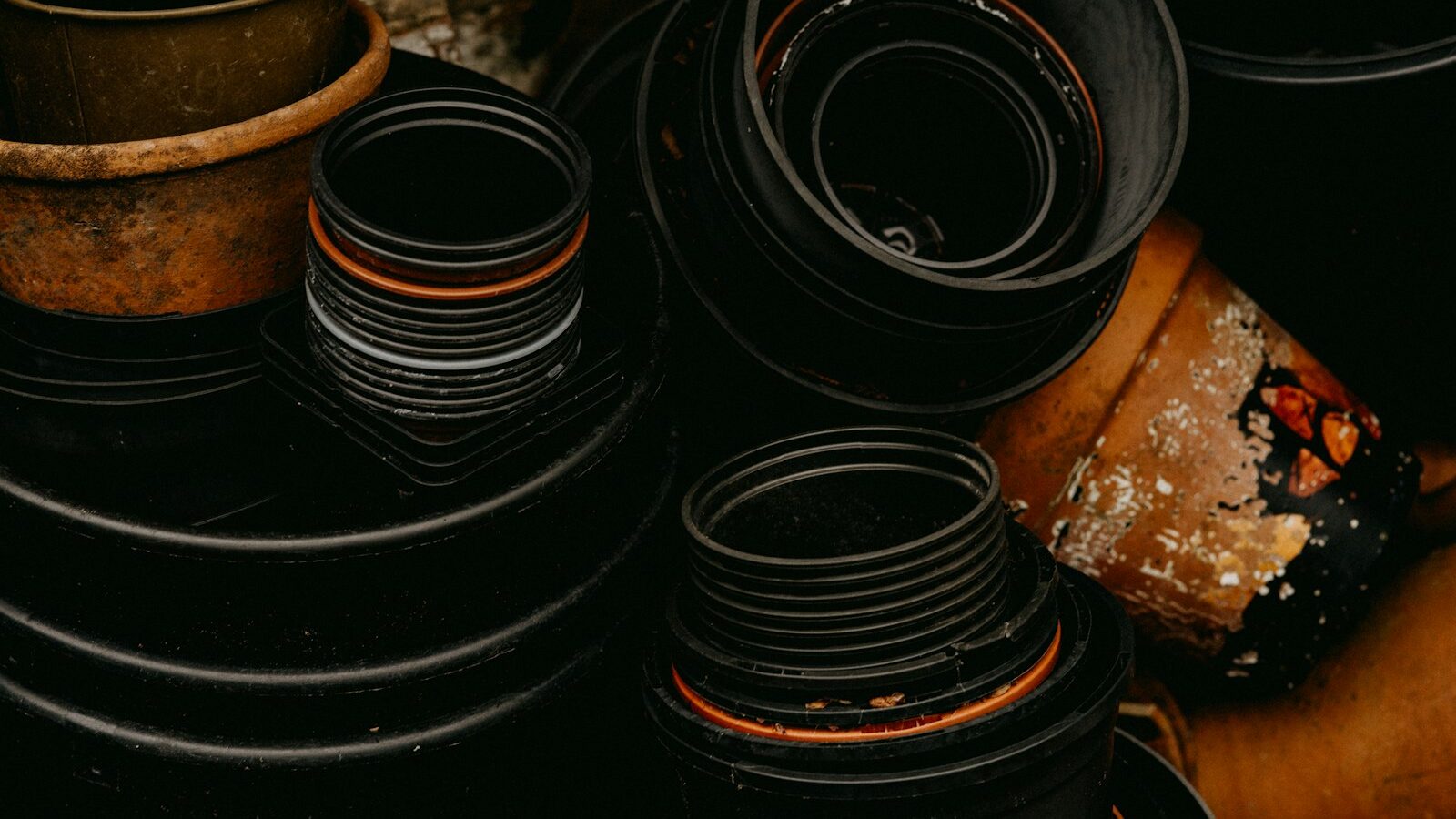 black and brown round metal containers