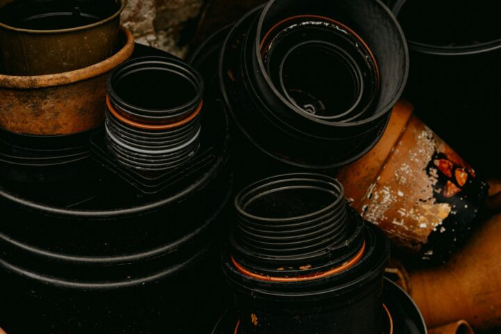 black and brown round metal containers