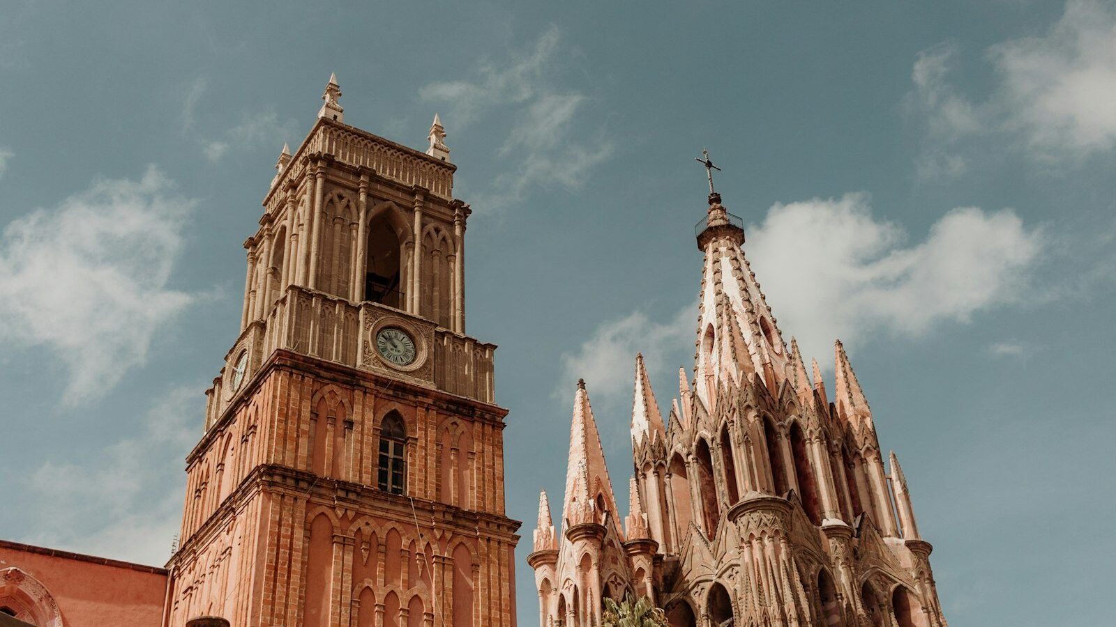a large cathedral with a clock on it's side