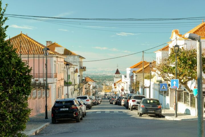 A street with cars parked on both sides of it
